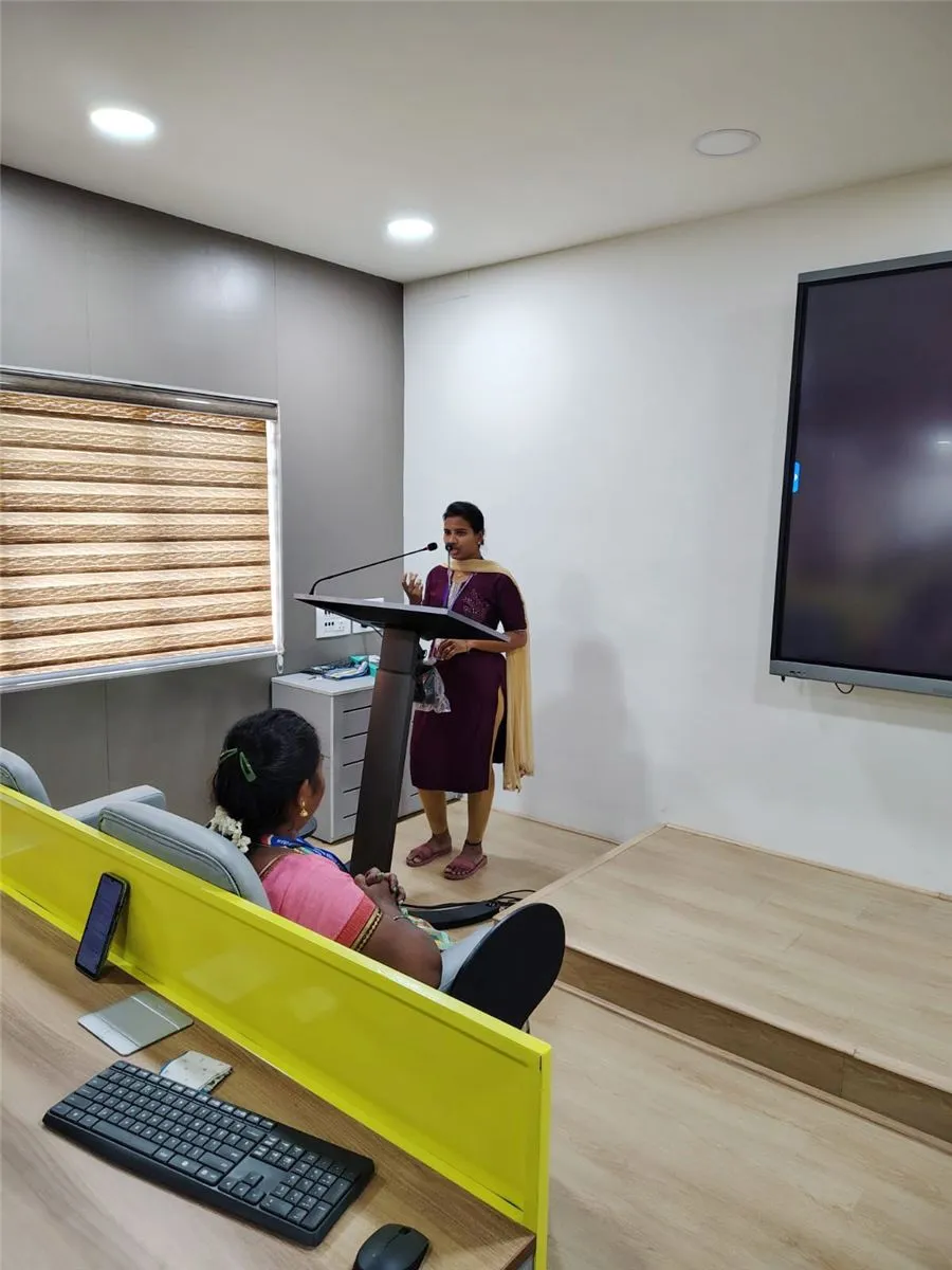 A student speaking at the podium in the smart classroom during Pitch Point